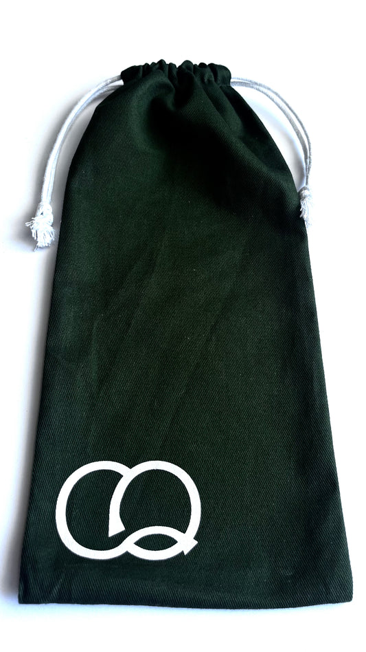 A vibrant green drawstring canvas carry bag featuring a collection of fashion stencils. The bag is made of durable fabric and has a drawstring closure at the top. Viewed from the front.