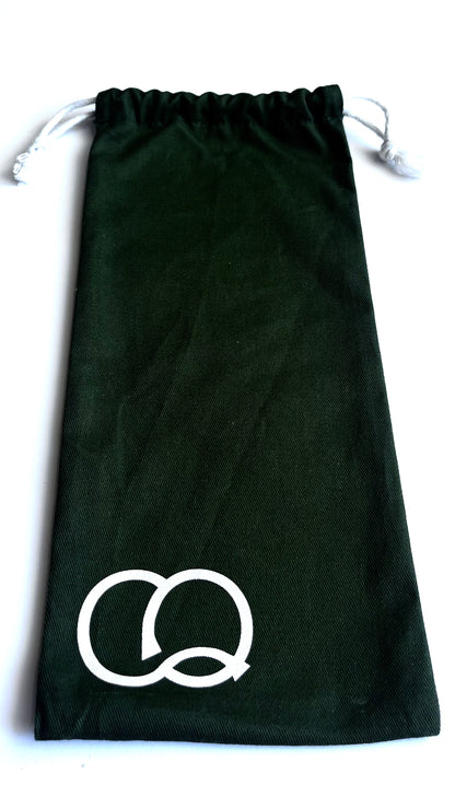 A vibrant green drawstring canvas carry bag featuring a collection of fashion stencils. The bag is made of durable fabric and has a drawstring closure at the top. Viewed from the front, open at the top.
